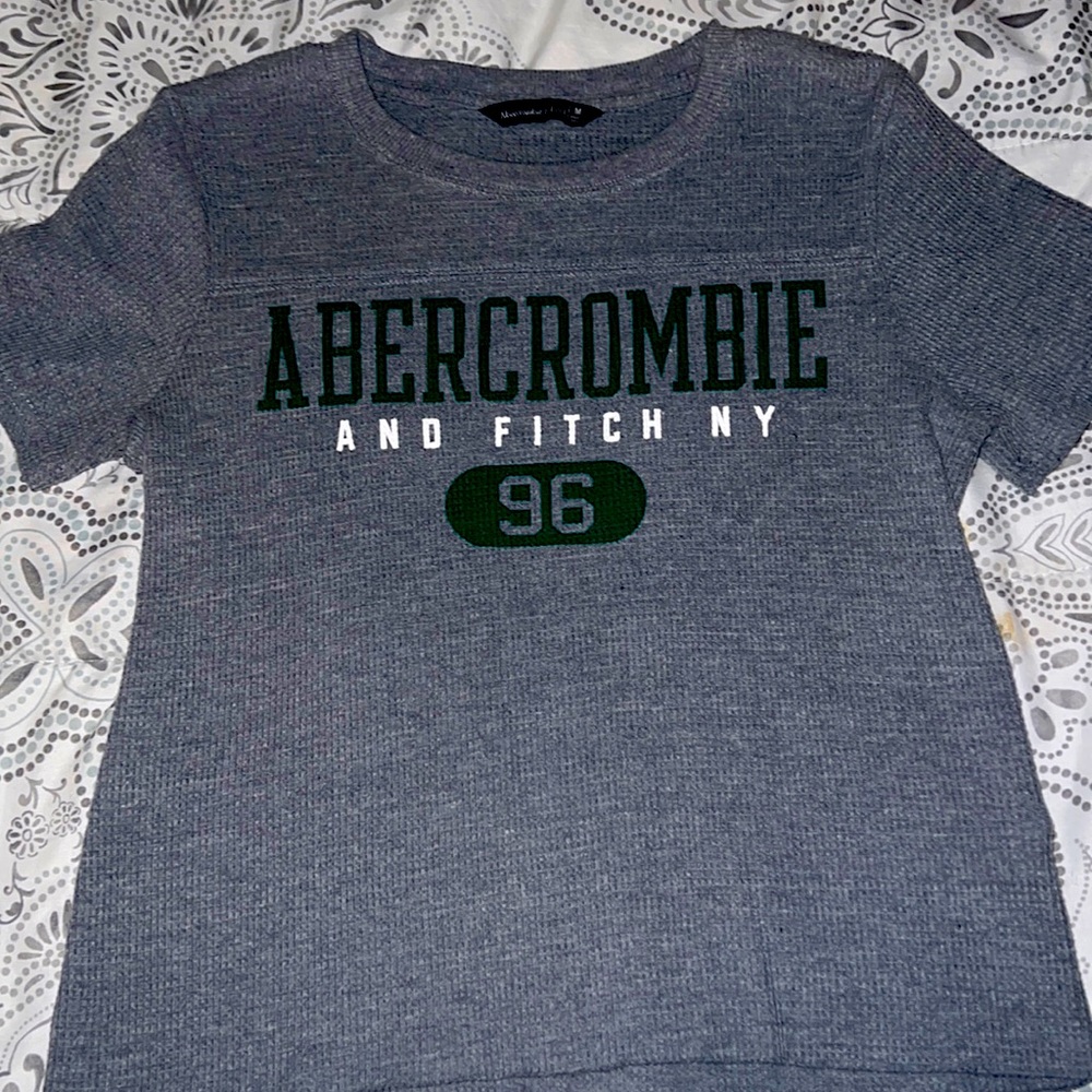 It’s a gray and green t-shirt has been worn once!